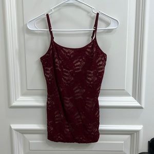 Such a flattering cami tank top! Sheer maroon color with nude underneath.